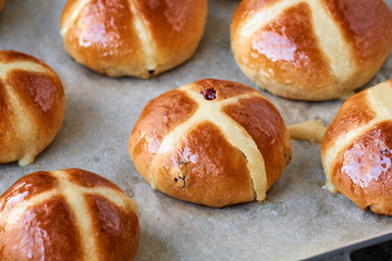Easter cross buns on a parchment paper