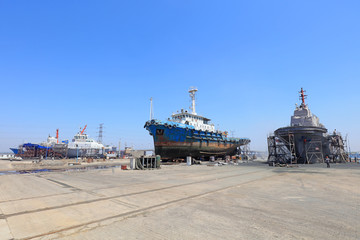 Fototapeta premium Ships awaiting repair are at the shipyard, Luannan County, Hebei Province, China