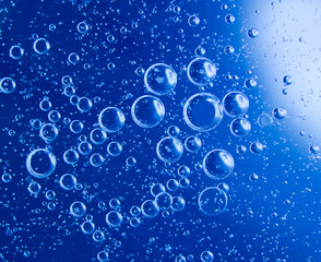 Blue clean water drop bubbles close-up background