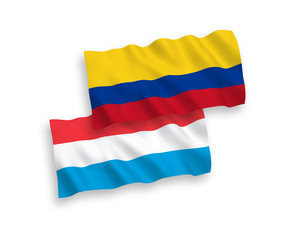 Flags of Colombia and Luxembourg on a white background