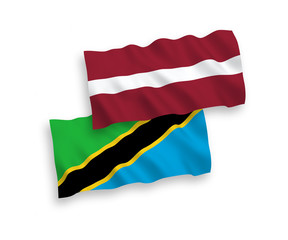Flags of Latvia and Tanzania on a white background