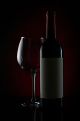 bottle and glass of red wine