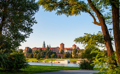 Krakow, Poland. Historic royal Wawel castle, cathedral and Vistula River naturally framed with...