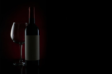 bottle and glass of red wine