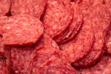 Red italian salami sausage closeup macro photo