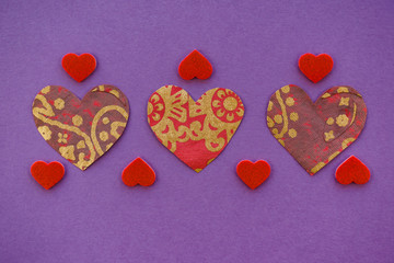 Colorful retro hearts on purple background, love, romance, valentine concept