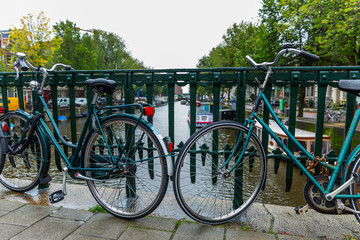 Fototapeta na wymiar Bicycle parking on a canal in the city. Close-up.