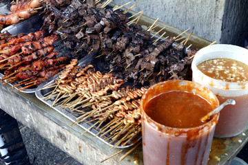 Assorted grilled pork innards such as intestine, liver, gizzard and blood in barbecue sticks