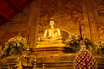 Chiang Mai , Thailand - January, 18, 2020 : Phra Singh statue of Viharn Lai Kam Wat Phra Singh is located in the western part of the old city centre of Chiang Mai.