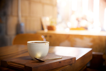 Hot coffee on wood table in cafe