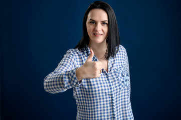 Young woman showing thumbs up