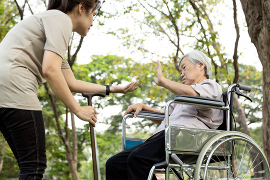 Excessive afraid in senior woman patients rejecting,gesture hand NO,female elderly who refuses to walk,asian old people fear of falling,feeling unconfident,avoid activities,physical deconditioning.