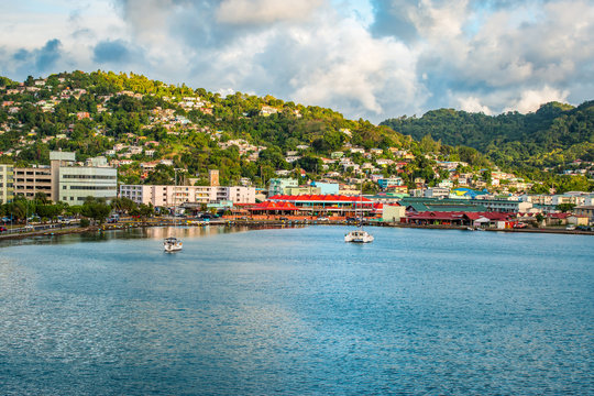 Castries, Saint Lucia, West Indies. Landscape with green mountain, bay of water and buildings at the harbor.