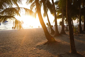 Papier Peint photo Plage blanche de Boracay Beautiful girl at sunset on the beach having fun and enjoying life. Boracay Island in the Philippines. Against the background of cliffs, beach and sea. White beach