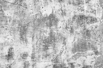Texture of a concrete wall with cracks and scratches which can be used as a background