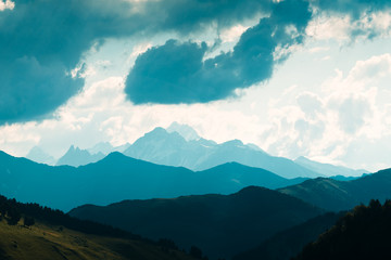 Landscape with beauty blue mountains range and cloudy sky