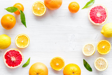 Citrus fruits - lemons, grapefruits - on white mockup, frame top-down copy space