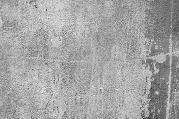 Texture of a concrete wall with cracks and scratches which can be used as a background