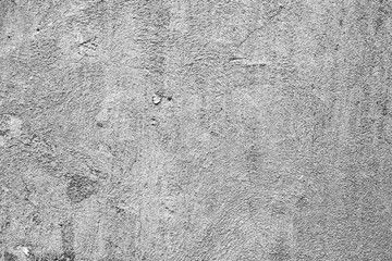 Texture of a concrete wall with cracks and scratches which can be used as a background