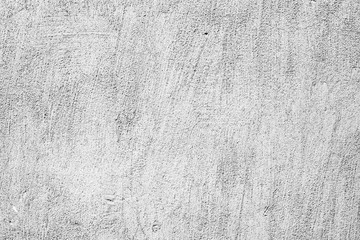 Texture of a concrete wall with cracks and scratches which can be used as a background