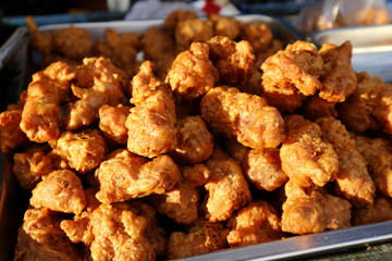 Deep fried chicken neck with breading sold at a street food stall