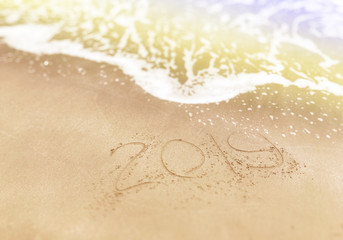 Happy new year , lettering numbers 2019 year on the sand