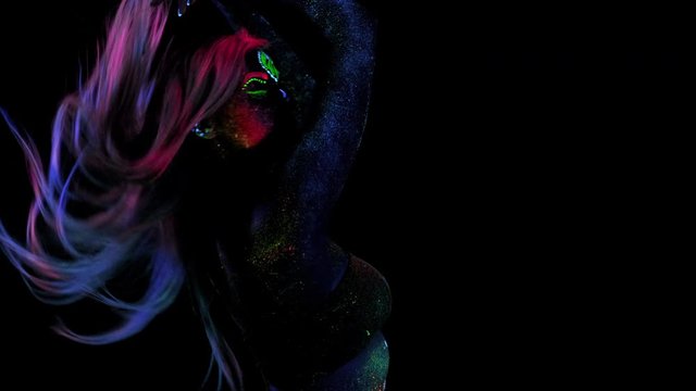 Fashion Model Woman in Neon UV Light, Beautiful Model Girl Colorful Bright Fluorescent Make-up, Painted Skin, Body Art Design of Disco Female in UV, Colorful Make up. Night club, Black Background.