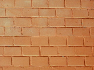 Brick wall, texture of light brown stone blocks close-up