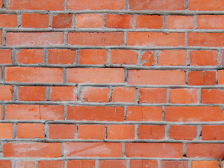 Brick wall, old texture of red stone blocks close-up