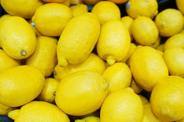 Colorful Lemons on the shelf In Market, healthy food
