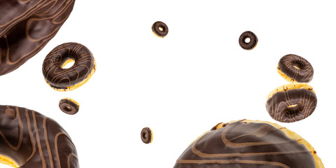 Sweet icing sugar food. Chocolate sweet fresh donuts flying on white.