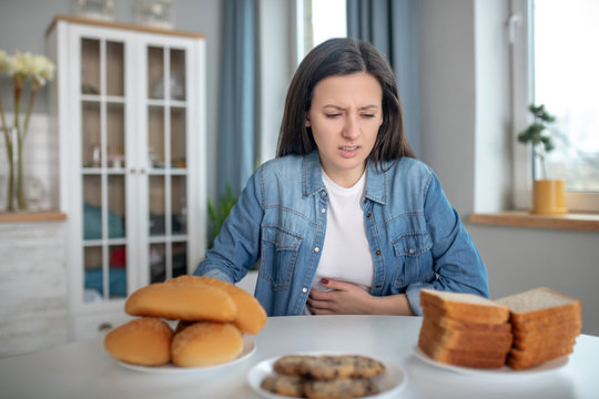 Woman having a stomach ache beacause of glutein