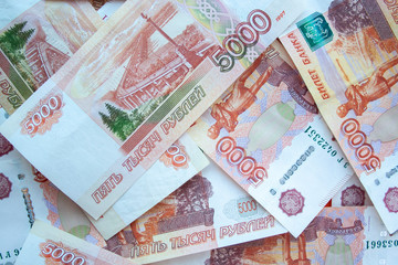 Rouble 5000 banknotes background top view. Texture of banknotes russian money