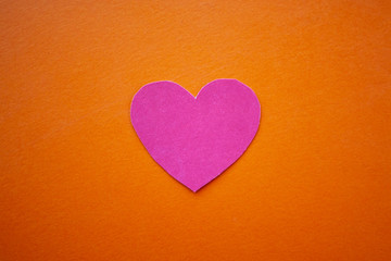 Love, valentines day, mothers day, women concept. Small paper heart shape on blue background top view copyspace