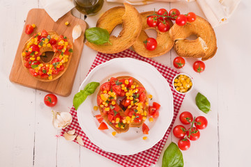 Friselle with tomatoes and mais.