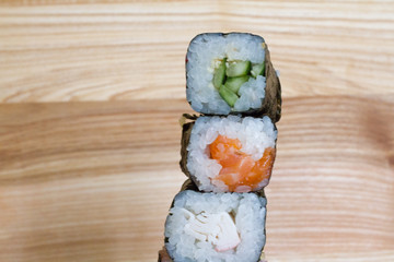 Fresh and delicious rolls, sushi and Japanese cuisine. rolls with salmon, avocado, cucumber, flying fish ROE and cream cheese inside. Sushi menu. Flatley food. the view from the top.