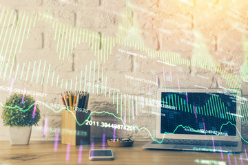 Naklejka premium Double exposure of chart and financial info and work space with computer background. Concept of international online trading.