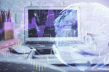 Financial graph colorful drawing and table with computer on background. Double exposure. Concept of international markets.