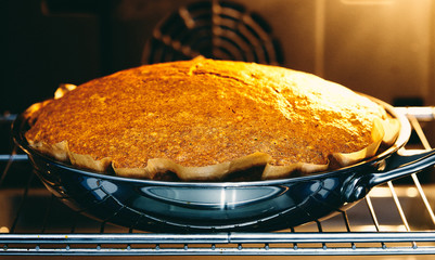 the cake is baked in the oven