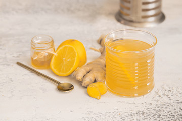 Ginger tea with honey and lemon. Warm revitalizing beverage used to help relieve cold and flu symptoms.
