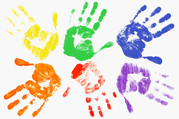 Handprints with the LGBT colors on a light background. The gay-lesbian movement. LGBT concep