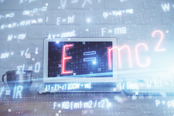 Desktop computer background and formula hologram writing. Double exposure. Education concept.