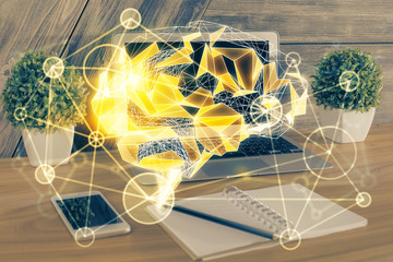 Multi exposure of work table with computer and brain hologram. Brainstorm concept.