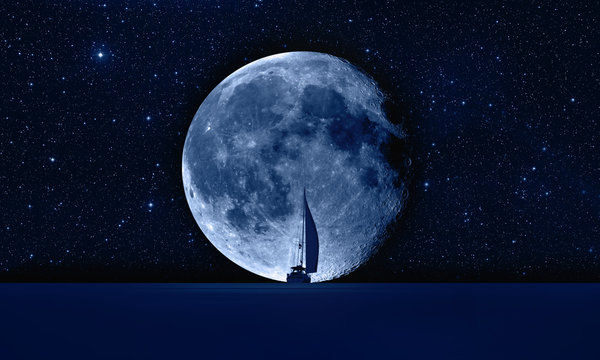 Lone yacht with super Blue Moon "Elements of this image furnished by NASA "