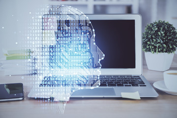 Double exposure of table with computer and brain hologram. Data innovation concept.