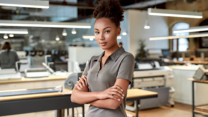 A strategy is beautiful as you. African american office worker posing with folded arms