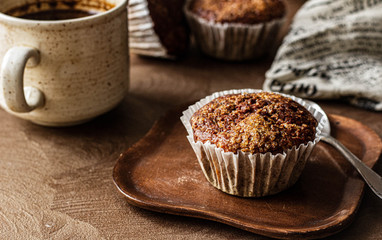 Coffee with caramelized cupcake. Homely