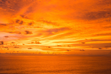 A beautiful ocean in Bali. The Pacific Ocean with large waves and tides that break on the rocks. The Indian Ocean is blue. Aqua Mente and Phantom Blue. Golden sunset on the ocean on the island of Bali