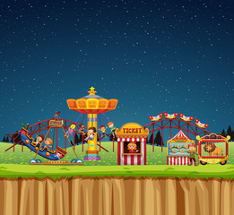 Circus scene with people on the rides at night