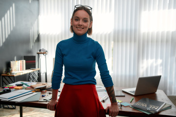 Confidence is the key to being a successful designer. Portrait of a young female designer in casual...